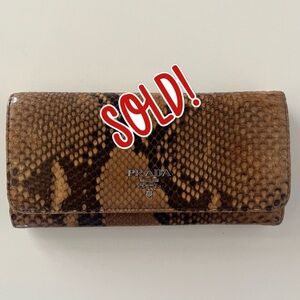 PRADA **RARE Python Matinee continental bi-fold wallet. Rose-colored interior.